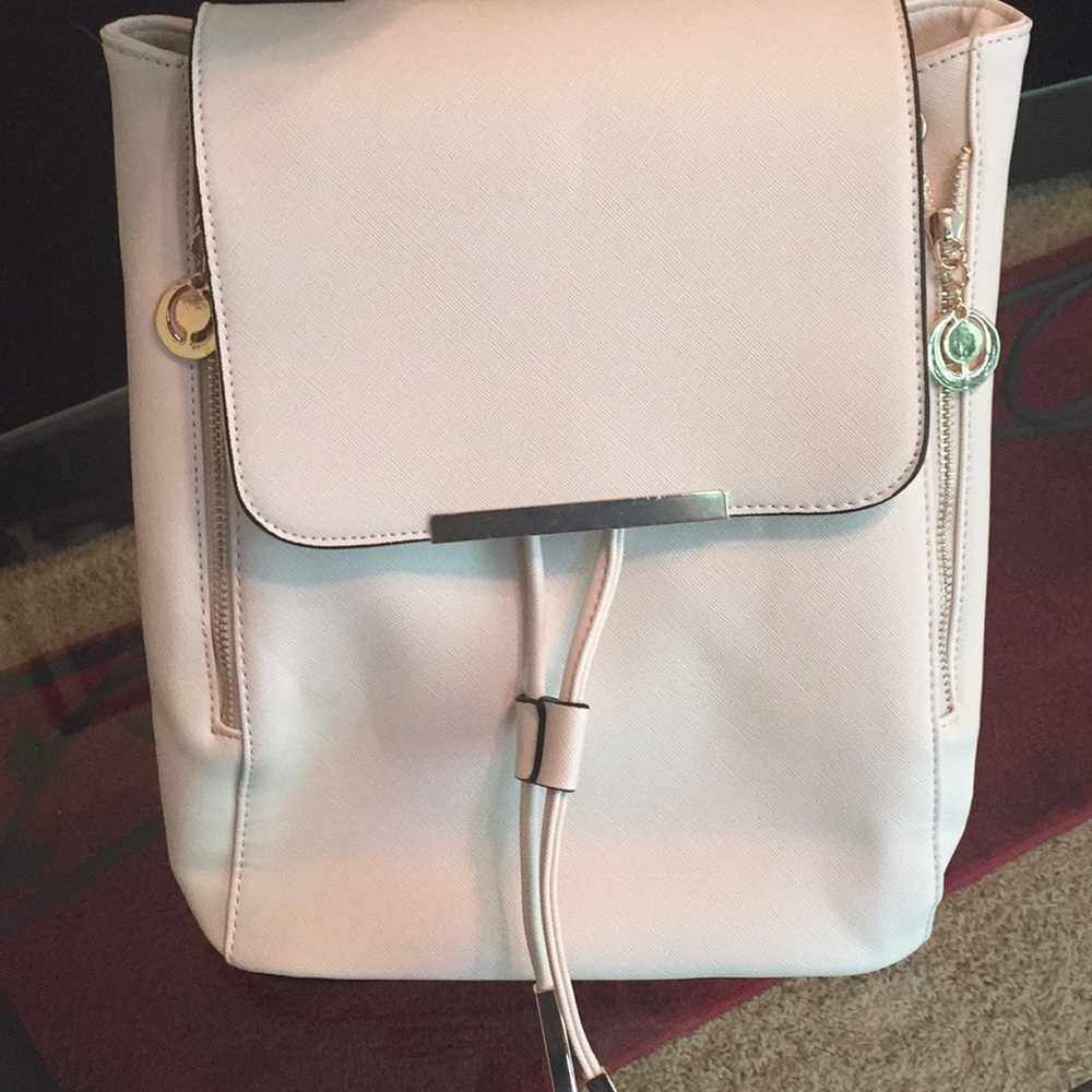 #3 Cream back pack purse!